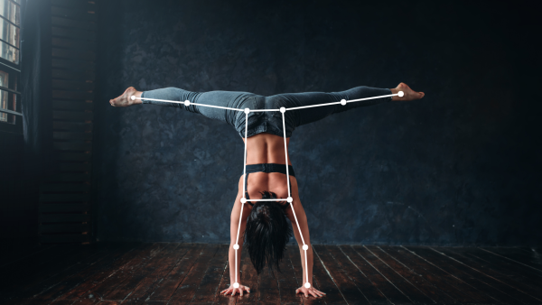 Image shows a woman doing gymnastics with pose estimation ai overlay from a fitness app