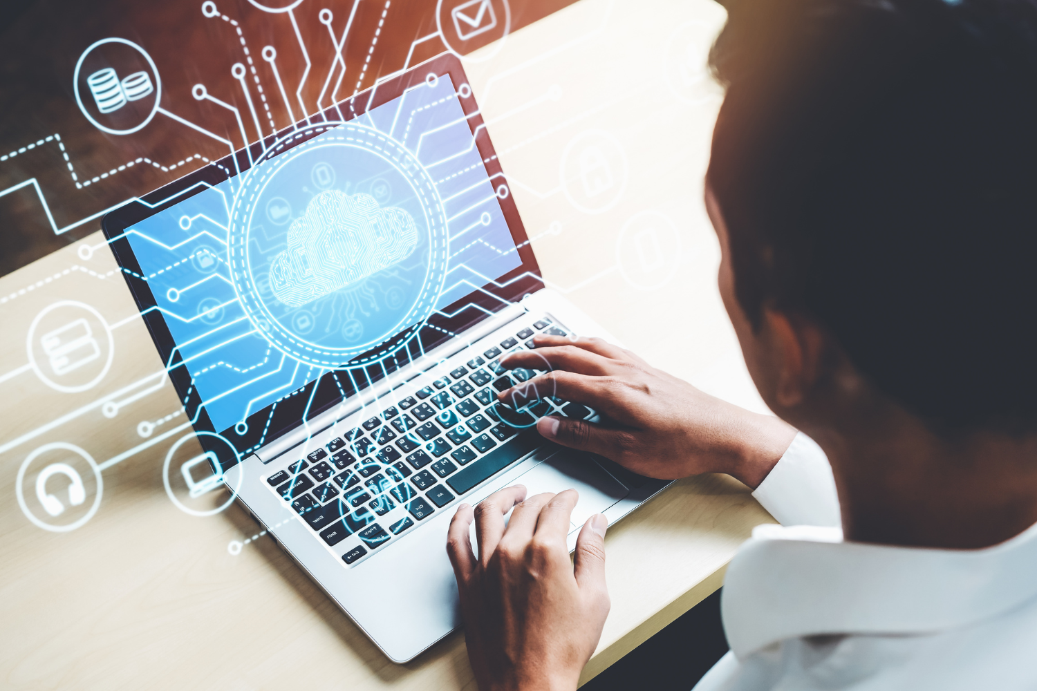 Image shows a medical professional looking at data on their laptop.