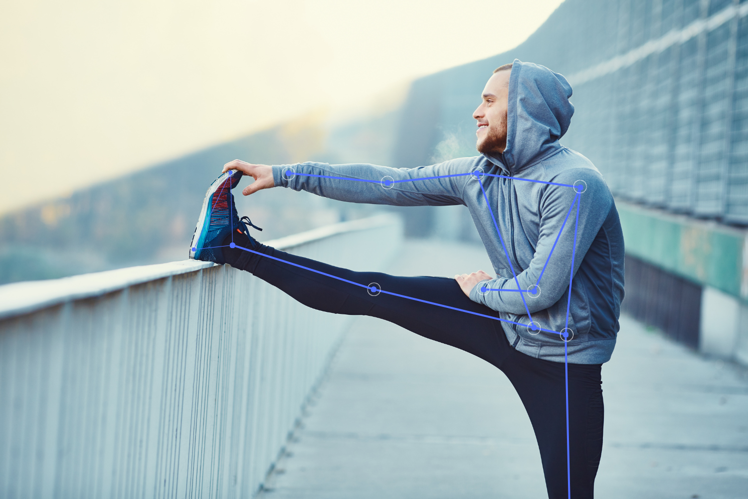 Image shows a runner stretching his leg on a run with pose estimation landmarks overlain on his joints.